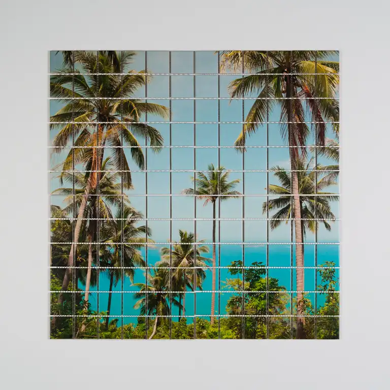High-end product photograph of a custom printed tile mosaic featuring tropical palm trees and turquoise ocean tones, captured with professional studio lighting by a Gold Coast product photographer.