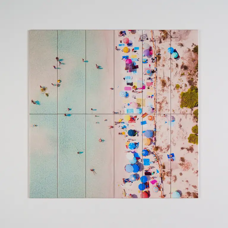 Printed tile mosaic showing a pastel beach scene with umbrellas and swimmers, photographed in South East Queensland for eCommerce and interior design display.