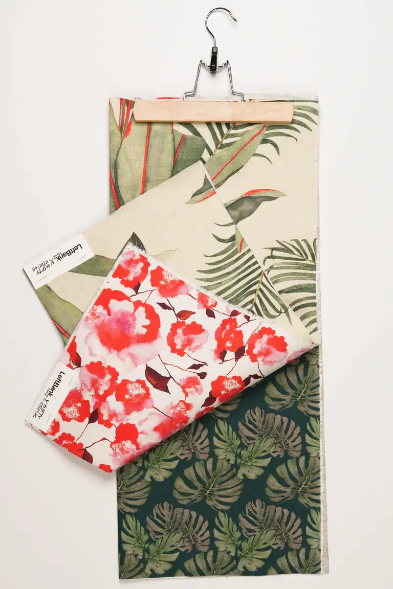 Detailed product photography of printed fabric samples with botanical and floral patterns, photographed in Australia for home décor and design presentation.