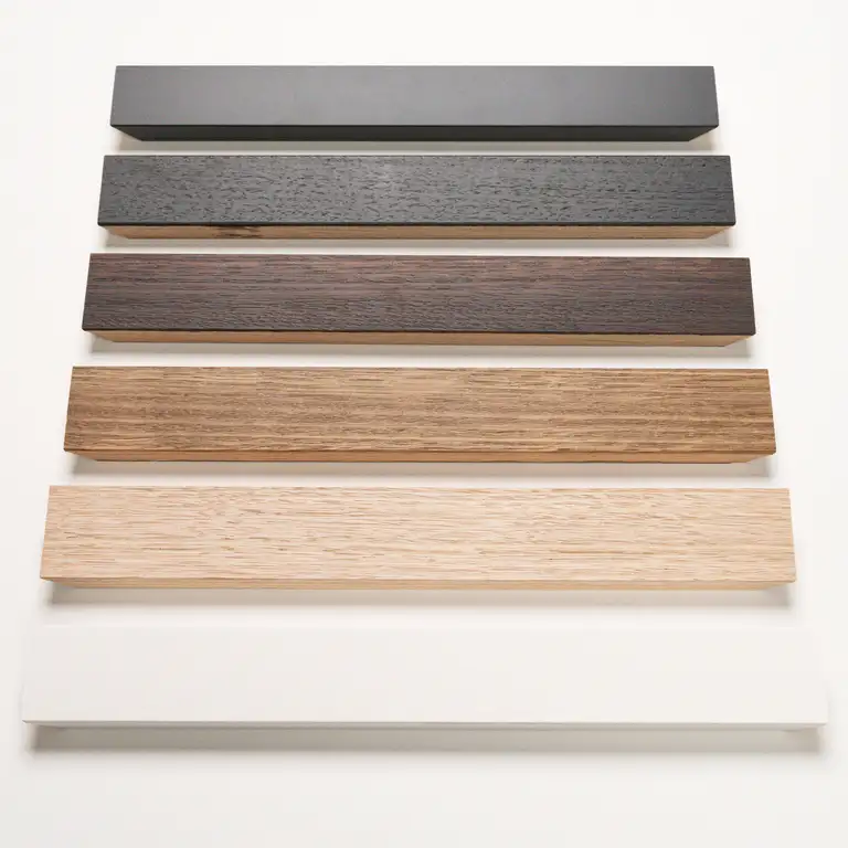 Studio product photo showing a range of timber art framing mouldings in neutral tones, photographed by a Gold Coast product photographer for catalogue and eCommerce use.