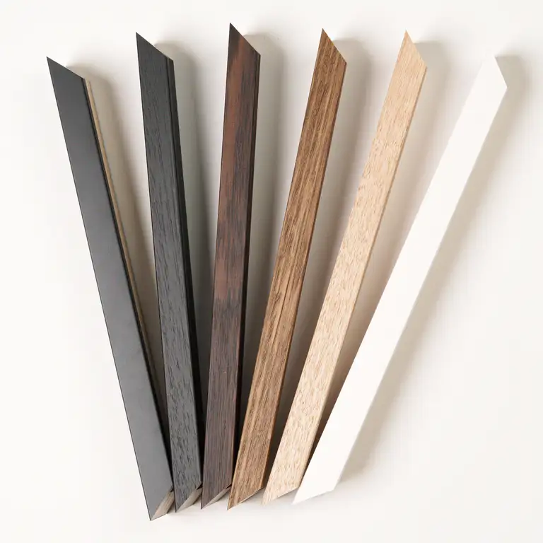 Professional image of wooden picture frame mouldings arranged diagonally on a white background, captured in South East Queensland with precise lighting and detail.