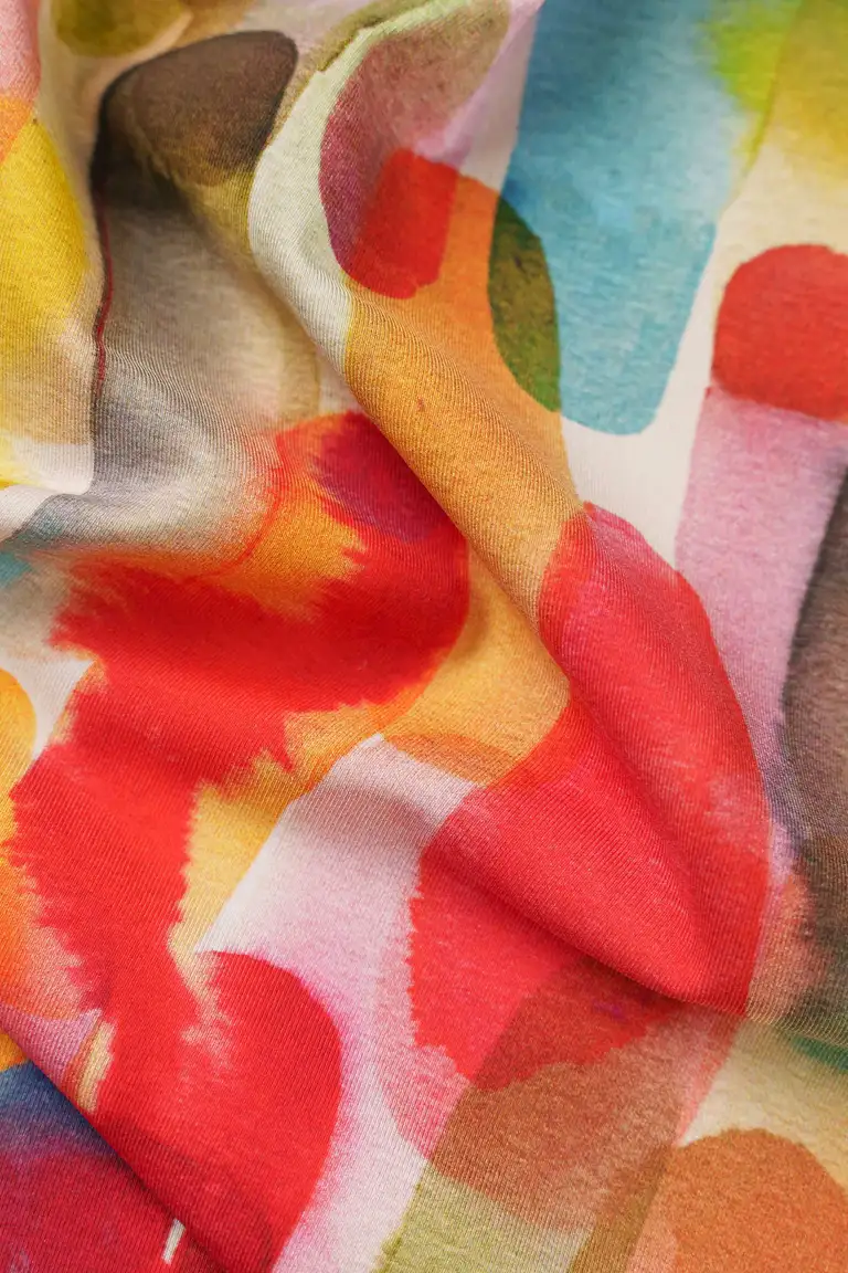 Close-up fabric product photo of colourful Repreve textile photographed by a Gold Coast eCommerce photographer, showing soft folds and recycled fibre texture.