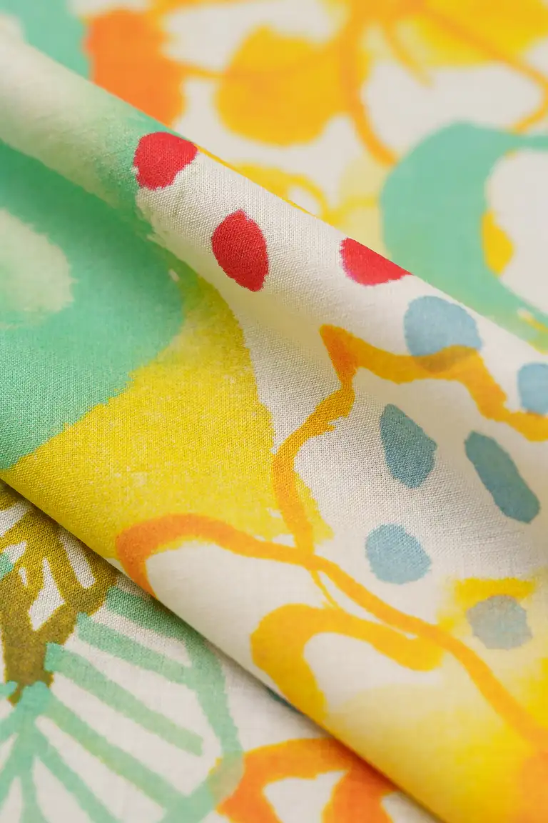 High-end macro image of printed voile fabric, captured in South East Queensland with focus on lightweight texture, weave detail, and vivid textile colour accuracy.